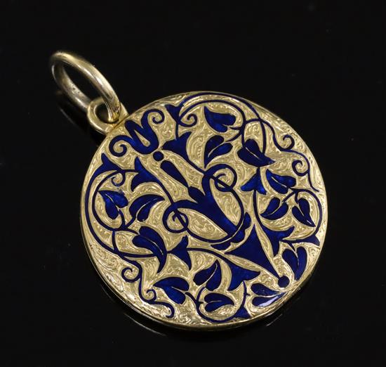 A Victorian gold and blue enamel mourning pendant locket, 25mm.